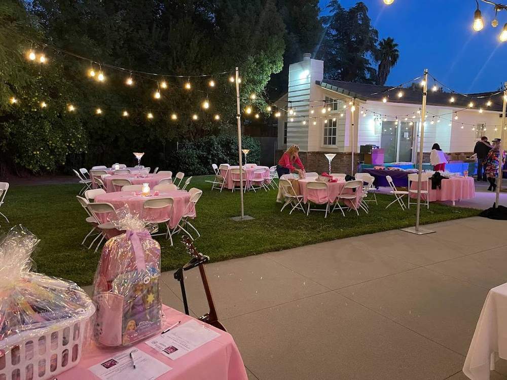 Evening lighting setup for an outdoor fundraiser